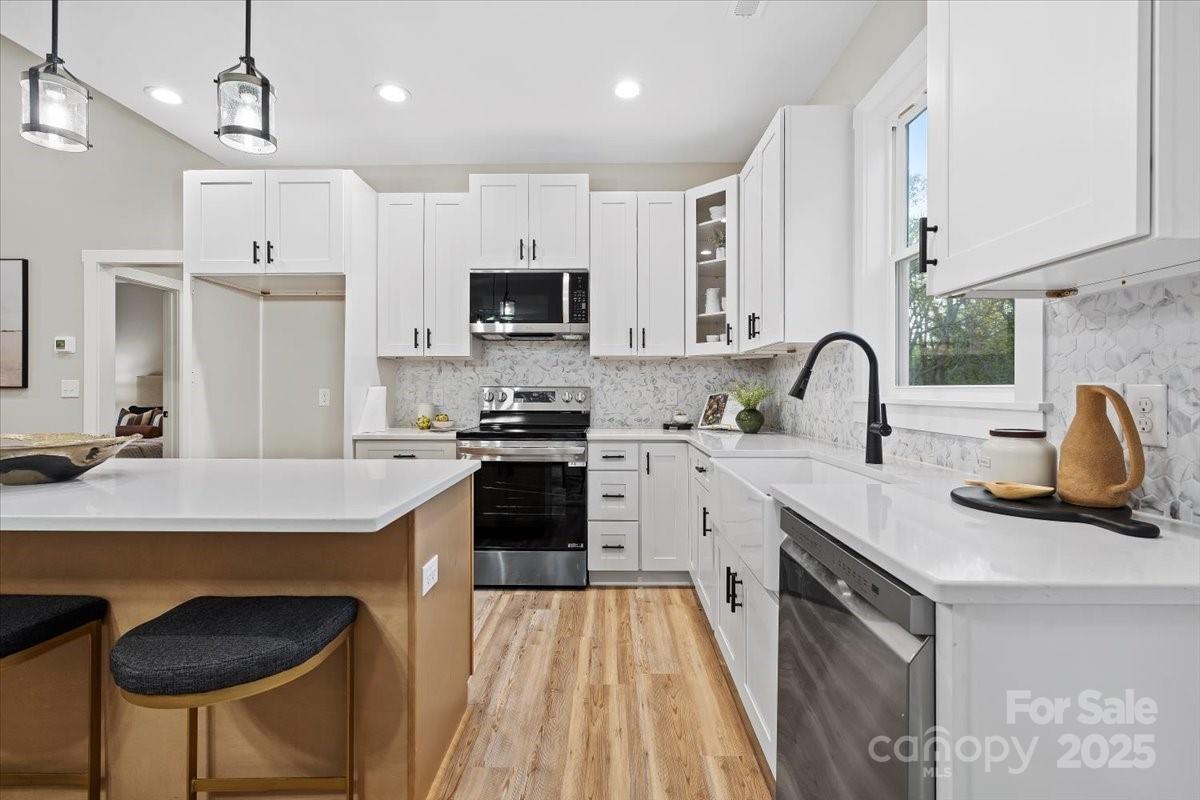 522 Waco Road Kings Mountain, NC 28086 - Photo 5 of 26 a kitchen with kitchen island a sink stove and refrigerator