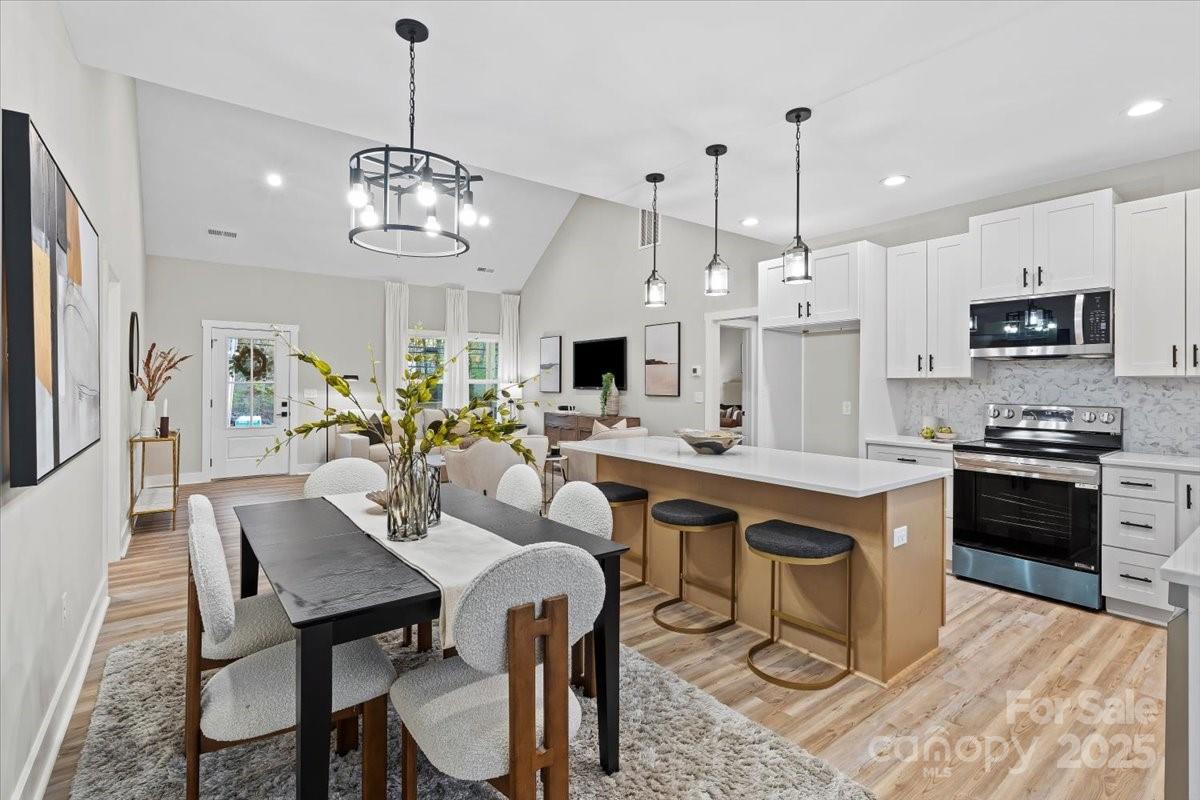 522 Waco Road Kings Mountain, NC 28086 - Photo 9 of 26 a large kitchen with a table and chairs