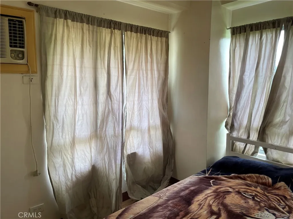 1201 Valderama Tower, Unit 325 Springtown, TX 76082 - Photo 11 of 16 a bedroom with a bed and a window