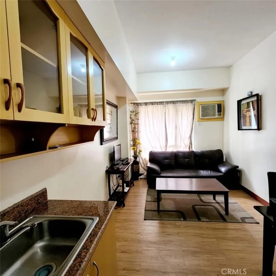 1201 Valderama Tower, Unit 325 Springtown, TX 76082 - Photo 8 of 16 a living room with a couch and a coffee table