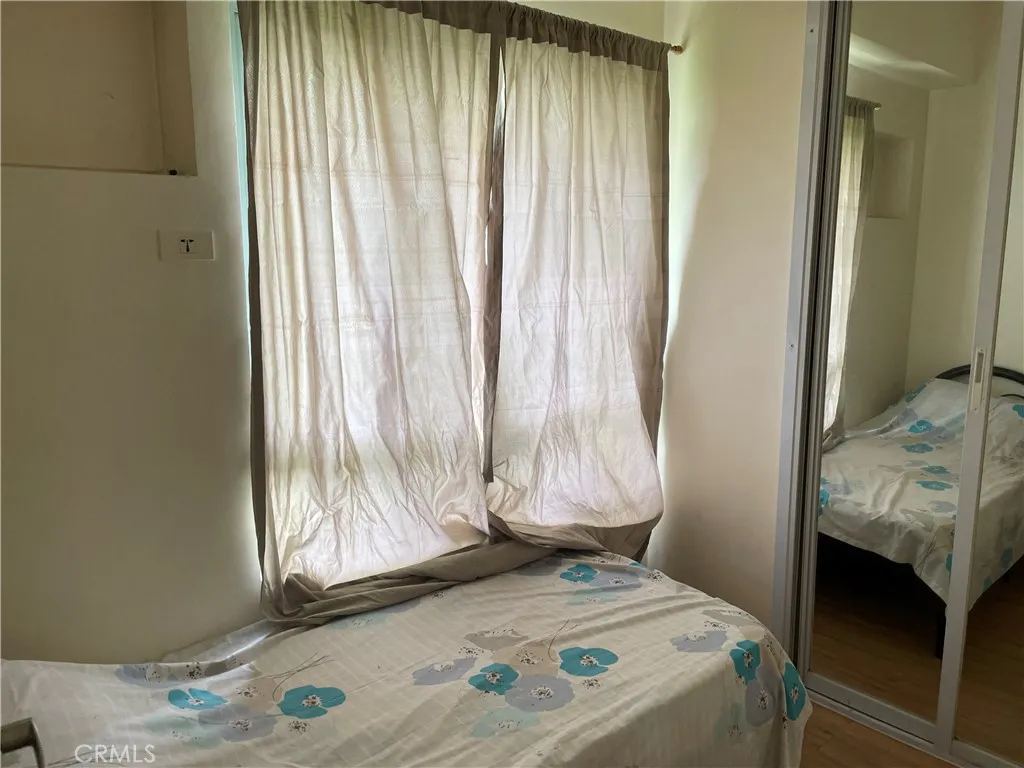 1201 Valderama Tower, Unit 325 Springtown, TX 76082 - Photo 10 of 16 a bedroom with a bed and a window