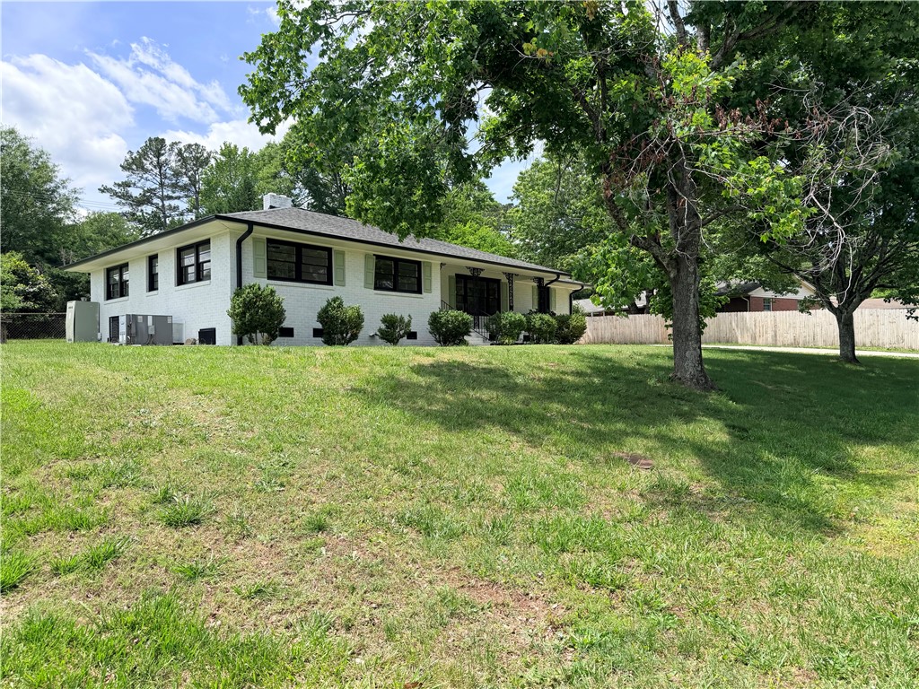 2304 Poplar Lane Anderson, SC 29621 - Photo 2 of 33 This charming home sits on a verdant lot, offering a peaceful retreat with ample outdoor space.