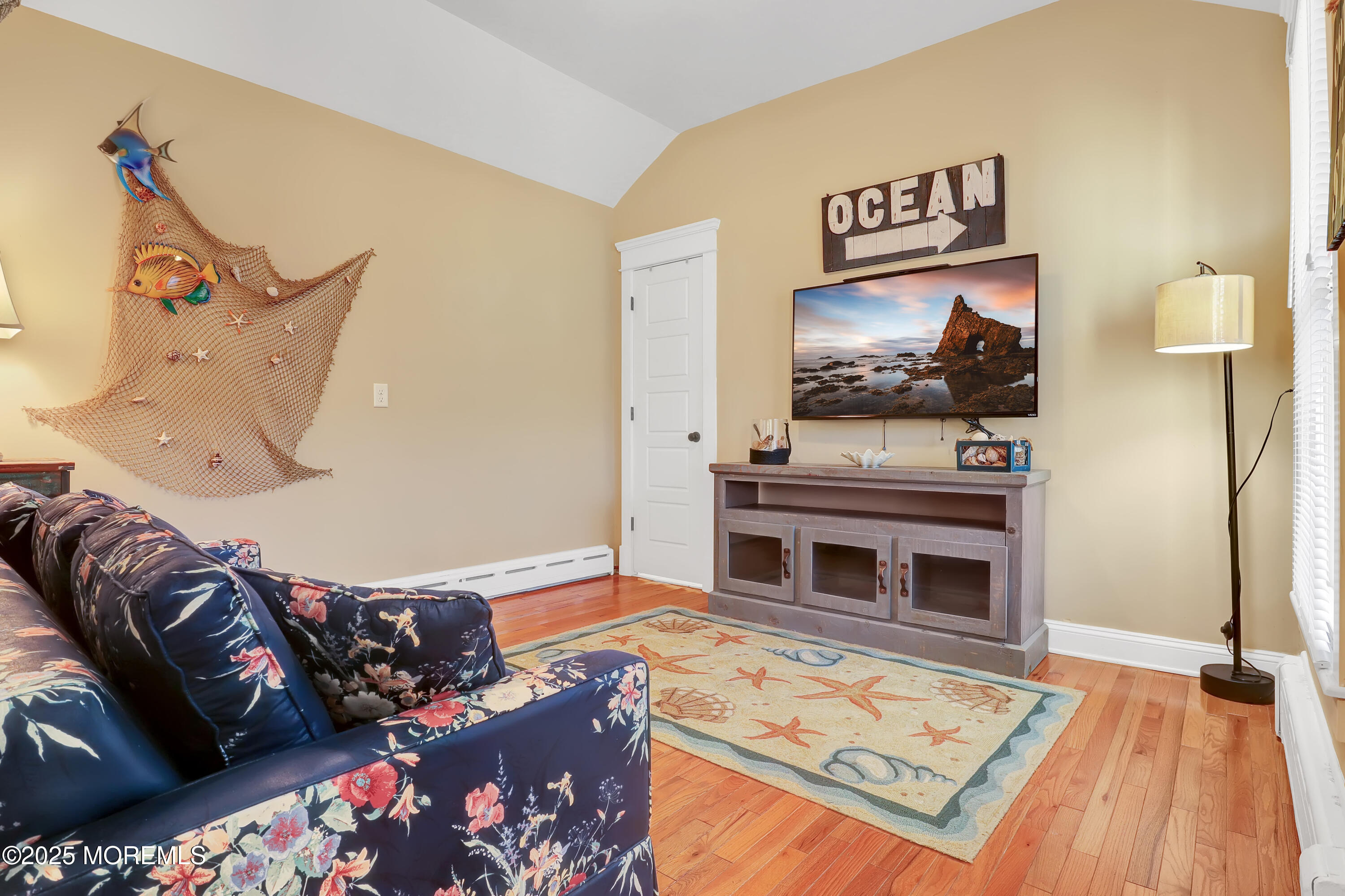 54 5th Street, Unit A Highlands, NJ 07732 - Photo 6 of 11 a living room with furniture and a flat screen tv