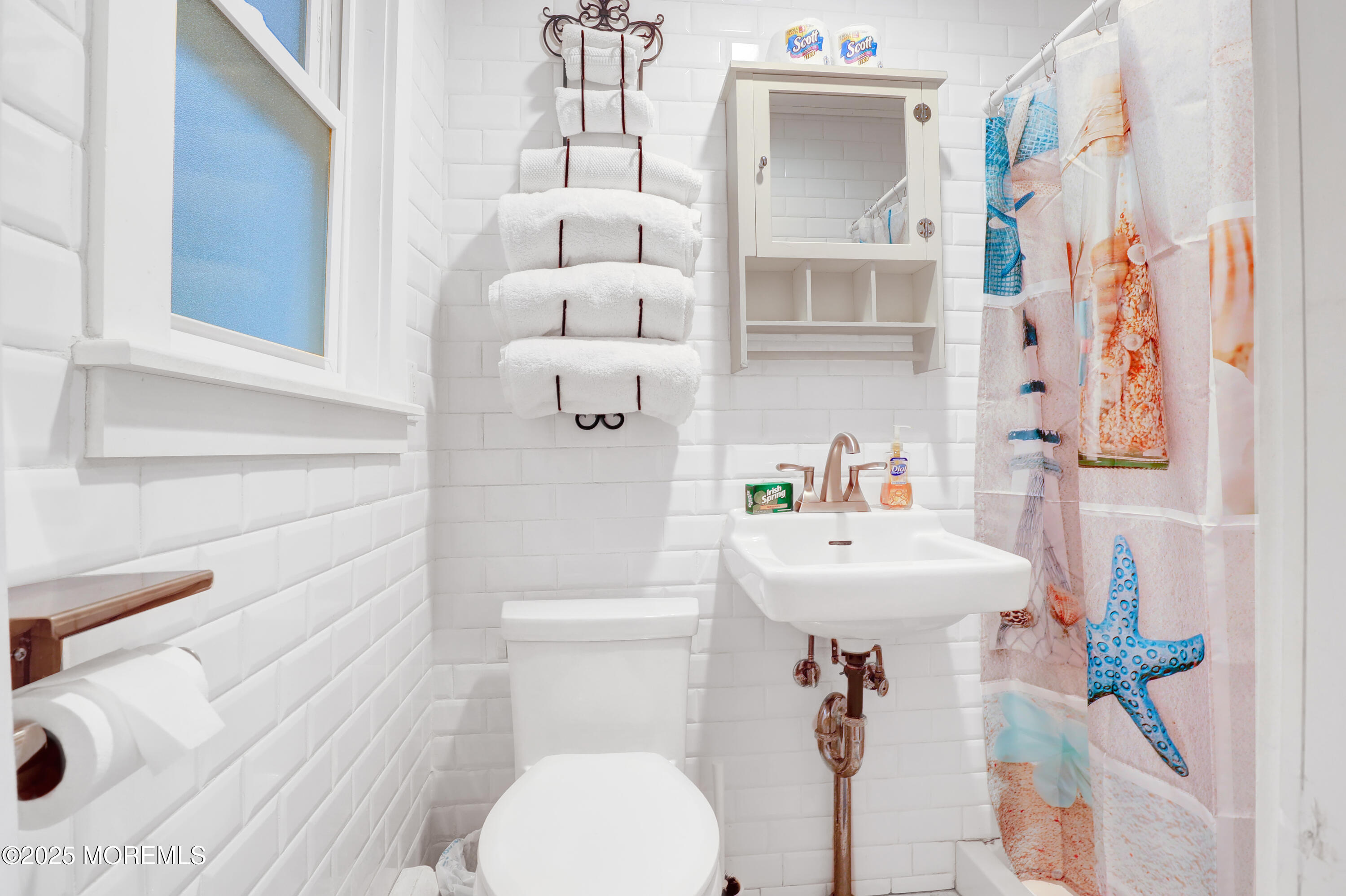 54 5th Street, Unit A Highlands, NJ 07732 - Photo 7 of 11 a bathroom with a sink toilet and shower