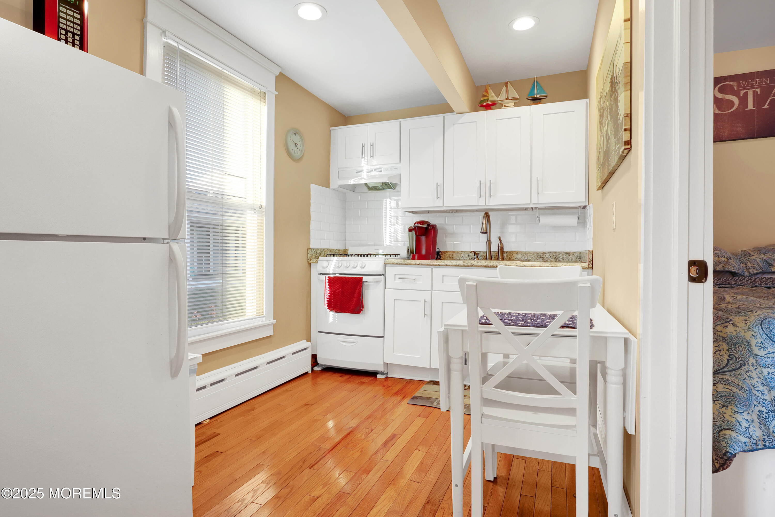 54 5th Street, Unit A Highlands, NJ 07732 - Photo 9 of 11 a kitchen with a stove a refrigerator and a sink