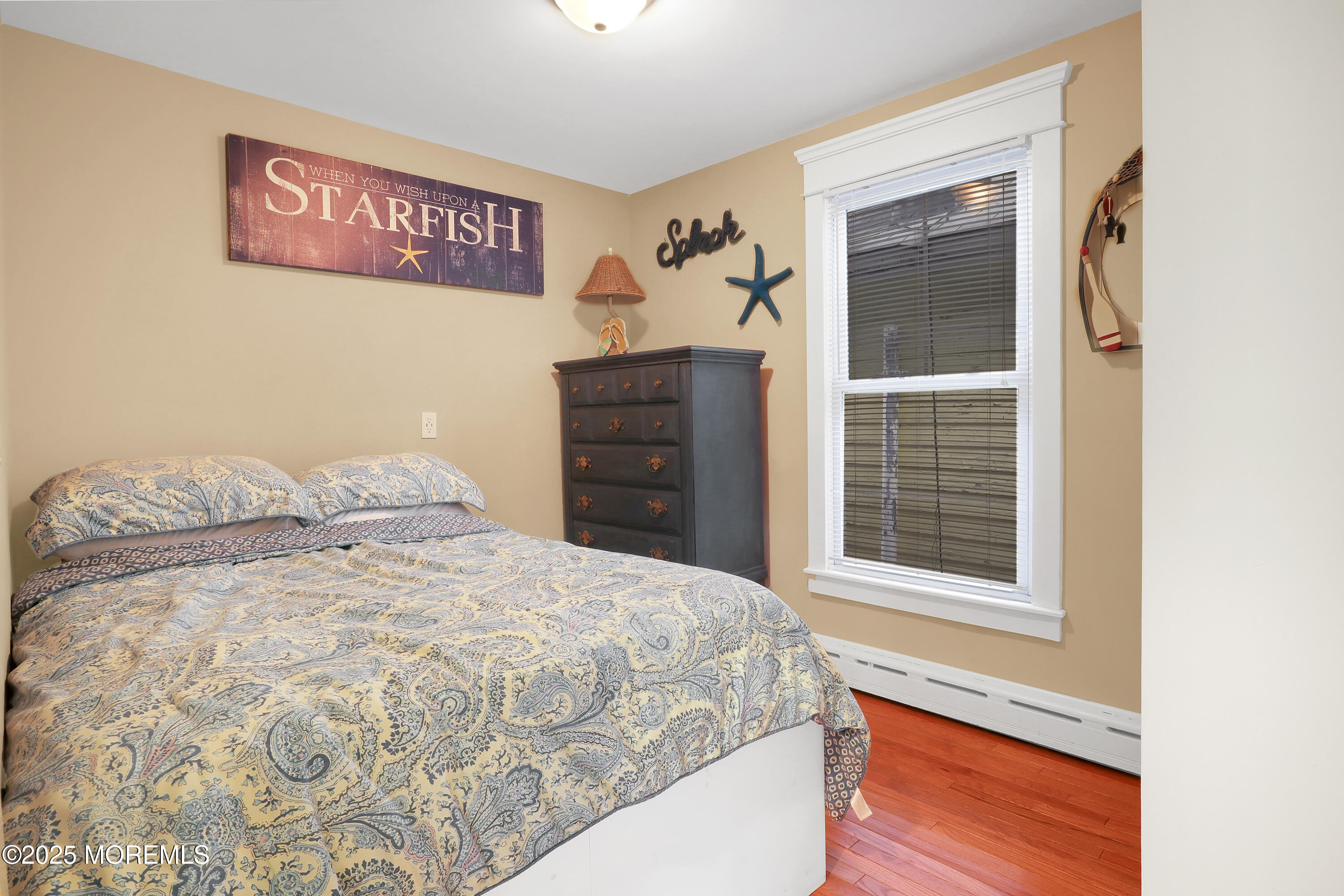 54 5th Street, Unit A Highlands, NJ 07732 - Photo 10 of 11 a bedroom with a bed and a window
