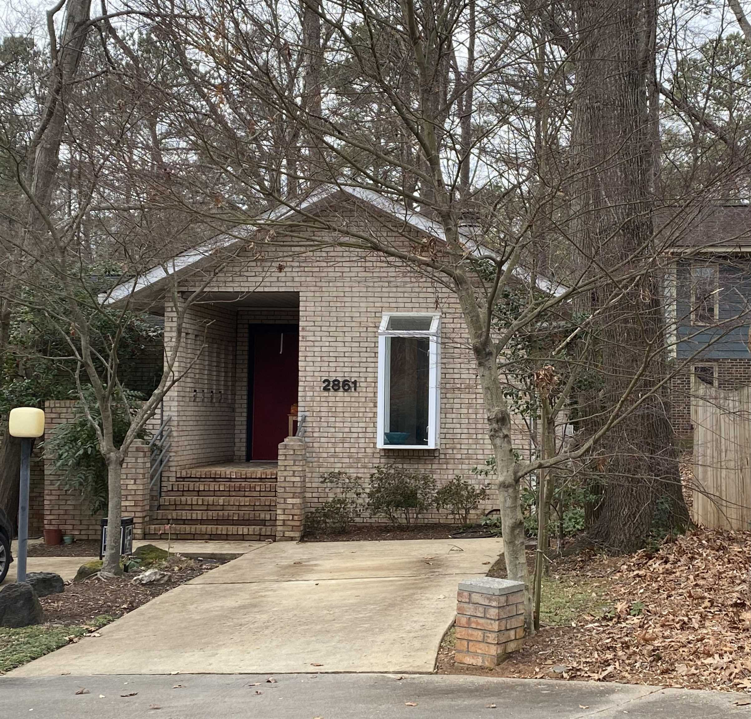 2861 Rue Sans Famille Raleigh, NC 27607 - Photo 1 of 9 a front view of a house with a tree