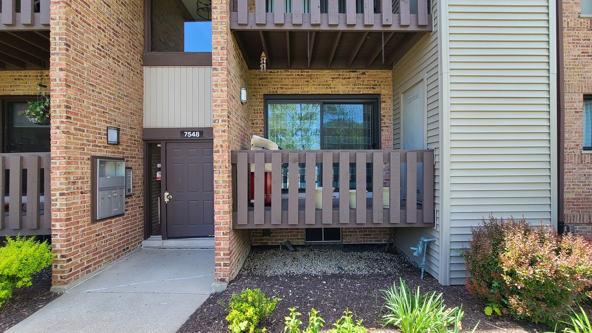 7548 Clarendon Hills Road, Unit 1B Willowbrook, IL 60527 - Photo 2 of 33 a view of a house with a yard