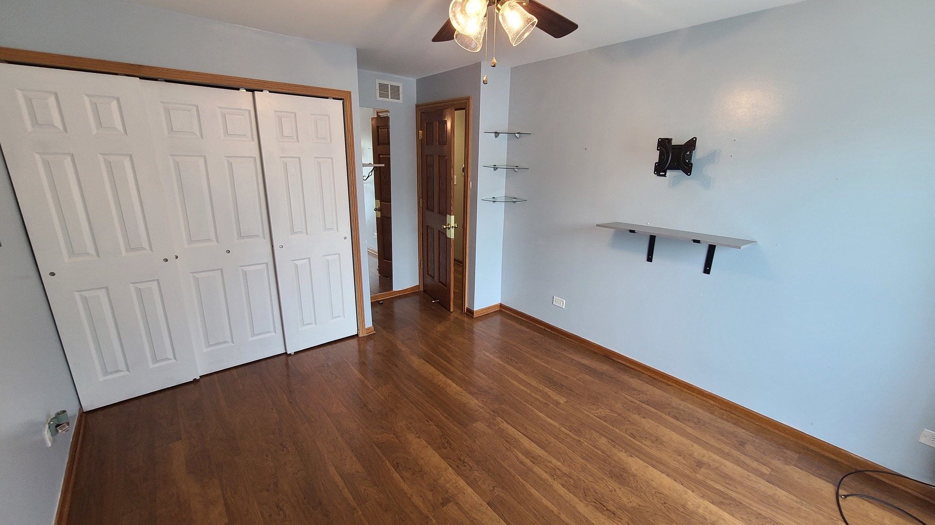 7548 Clarendon Hills Road, Unit 1B Willowbrook, IL 60527 - Photo 21 of 33 wooden floor in an empty room