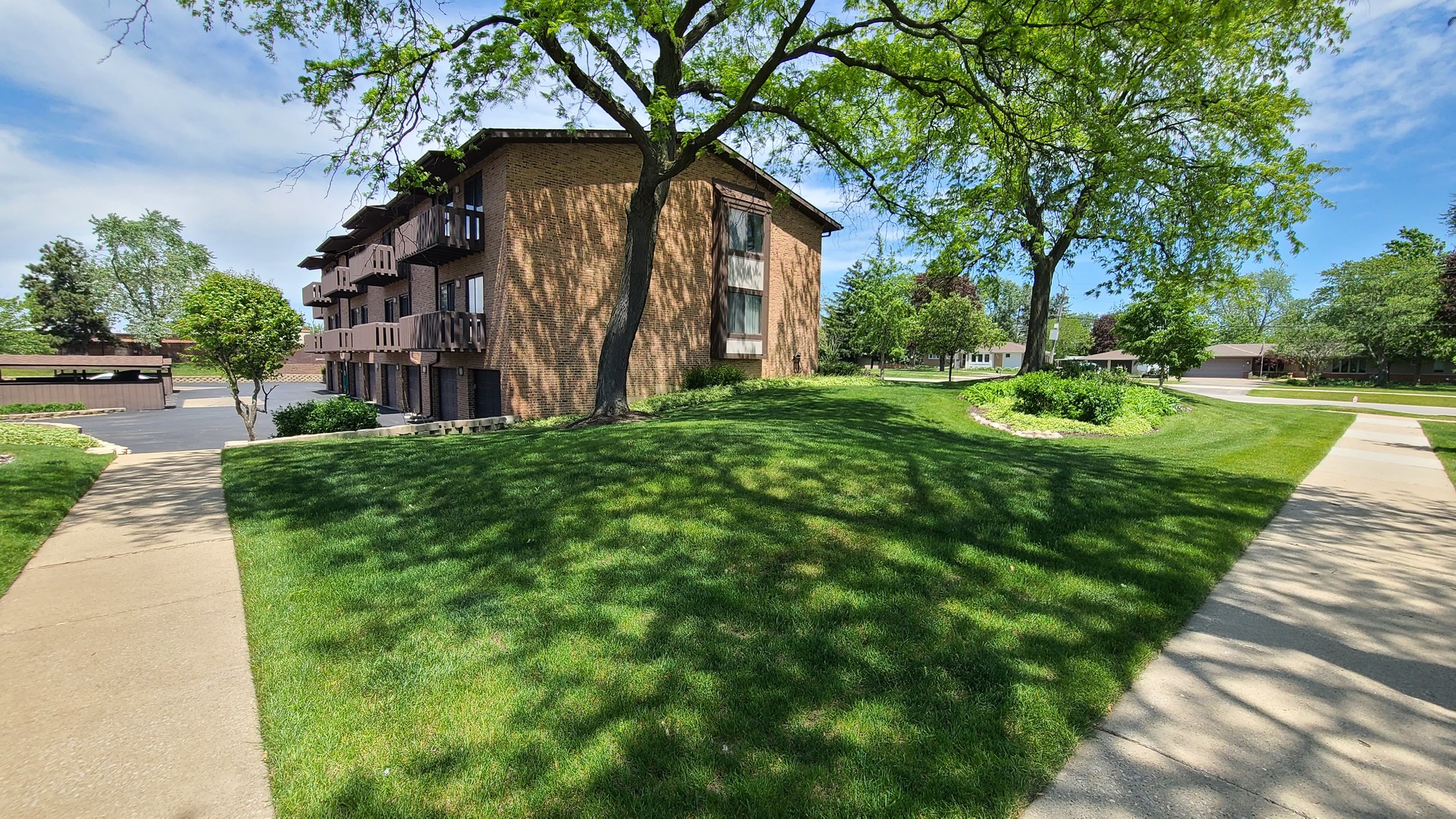 7548 Clarendon Hills Road, Unit 1B Willowbrook, IL 60527 - Photo 33 of 33 a front view of a house with garden
