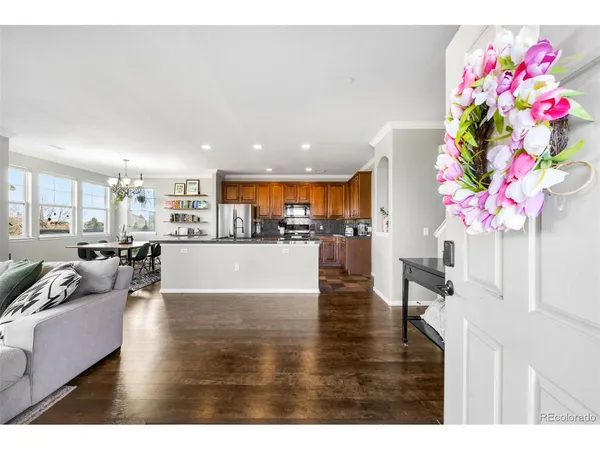 a living room with furniture and flowers