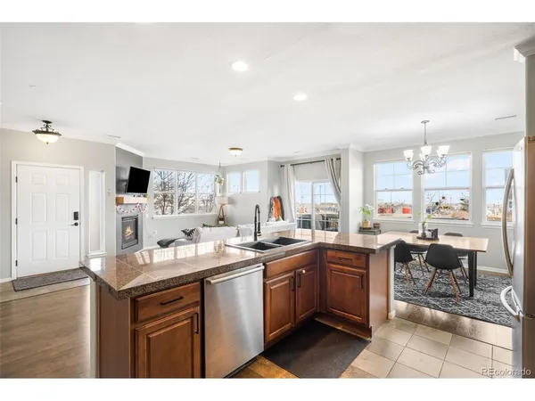 a kitchen with lots of counter top space sink and view living room