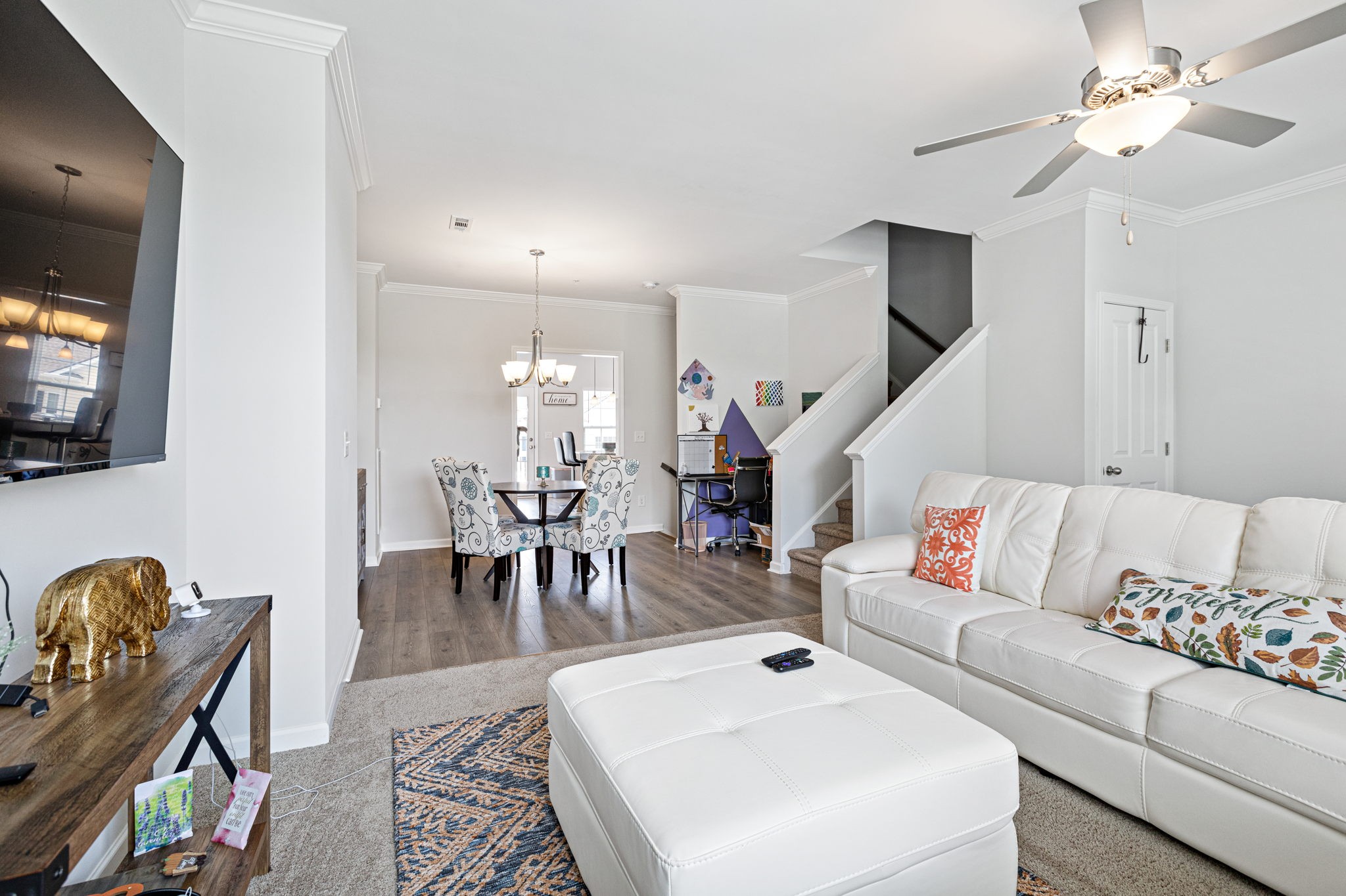 204 Kinsale Drive Spring Hill, TN 37174 - Photo 14 of 31 a living room with furniture a flat screen tv and kitchen view