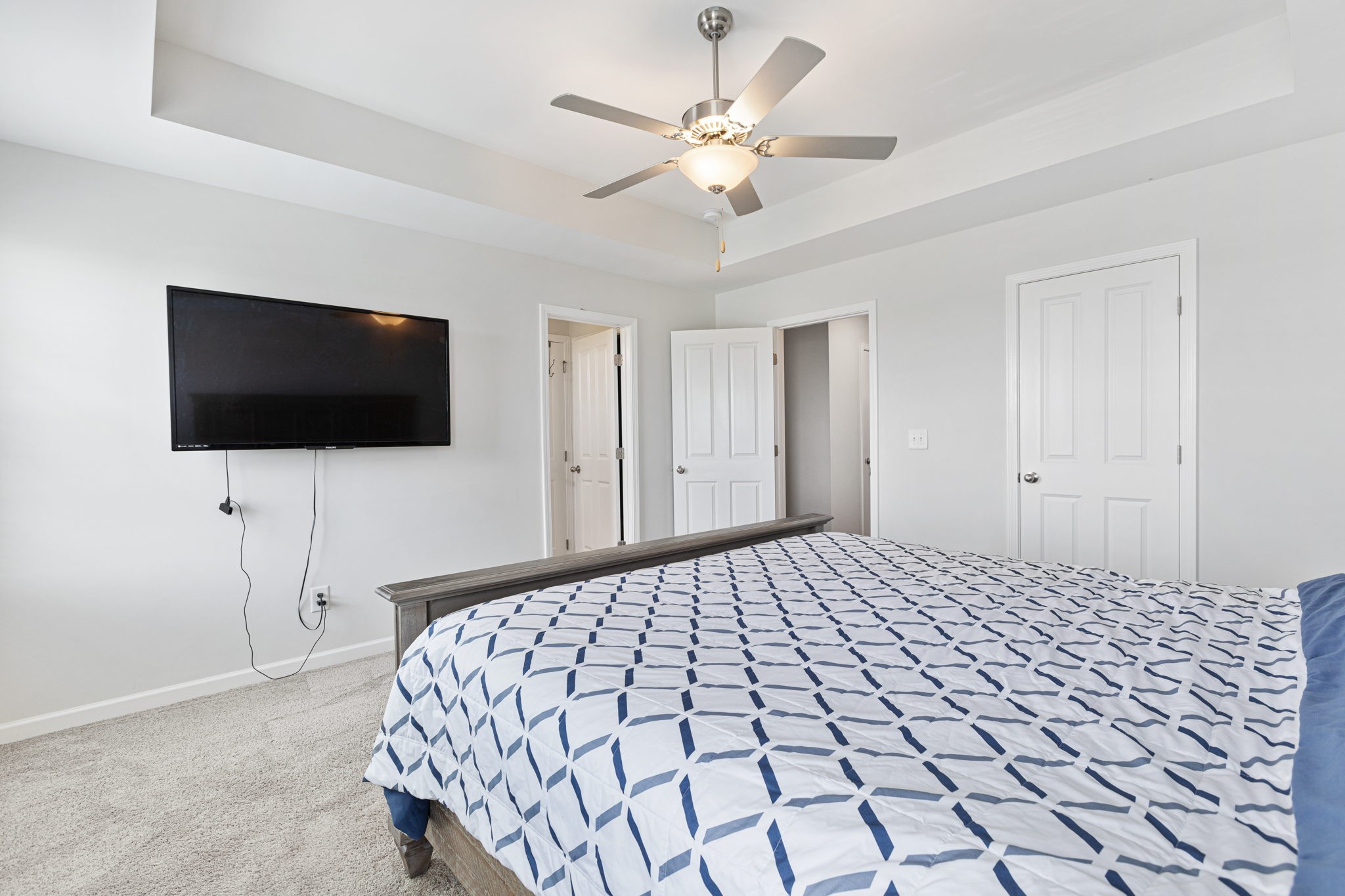 204 Kinsale Drive Spring Hill, TN 37174 - Photo 17 of 31 a bedroom with a bed and a flat screen tv