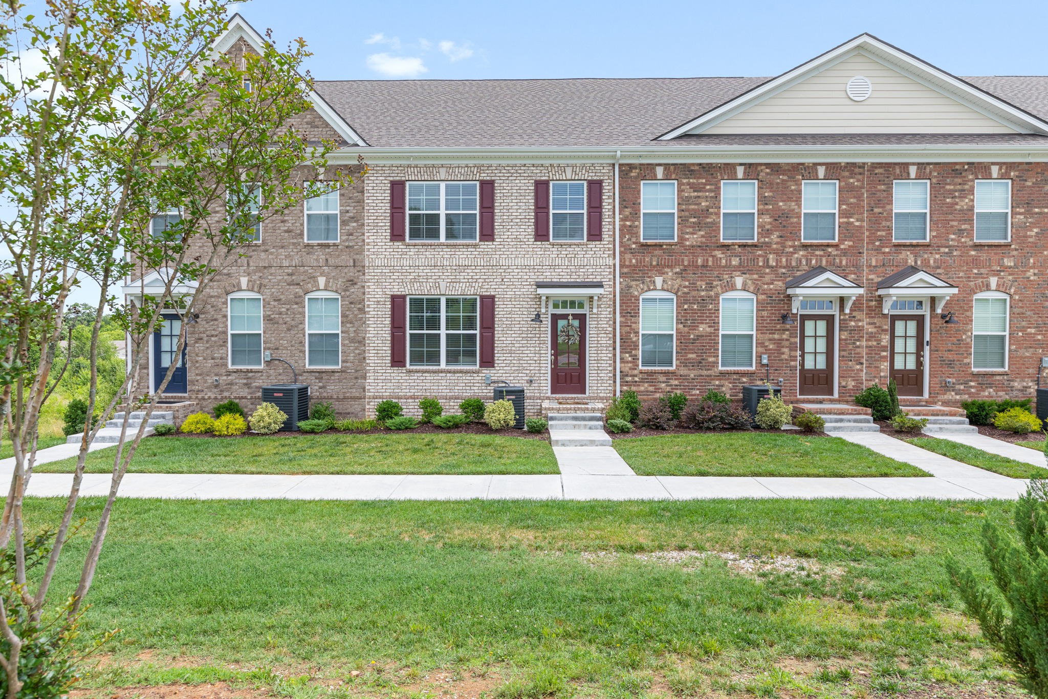 204 Kinsale Drive Spring Hill, TN 37174 - Photo 2 of 31 a front view of a house with a yard and green space