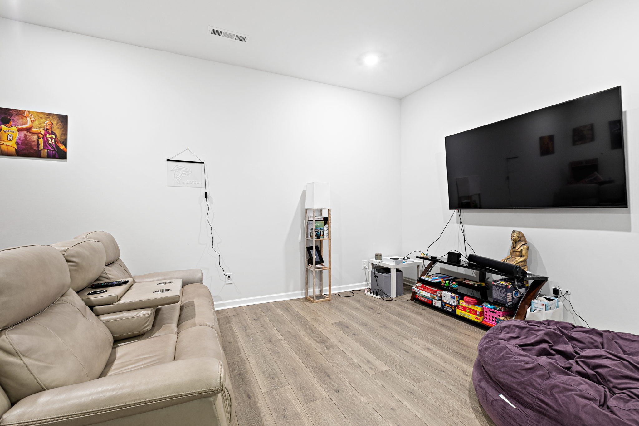 204 Kinsale Drive Spring Hill, TN 37174 - Photo 24 of 31 a living room with furniture and a flat screen tv