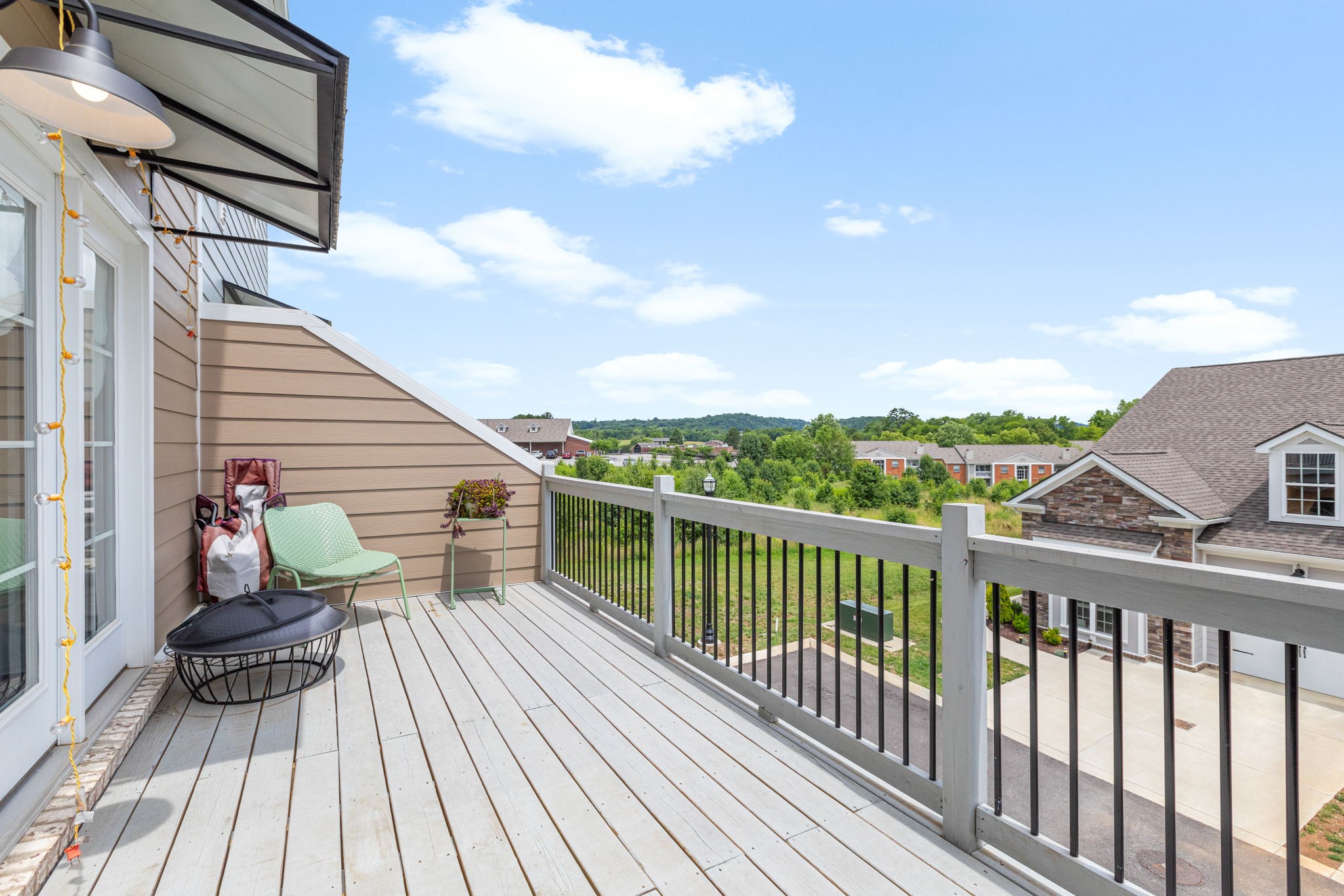 204 Kinsale Drive Spring Hill, TN 37174 - Photo 29 of 31 a view of a balcony with chairs and wooden floor