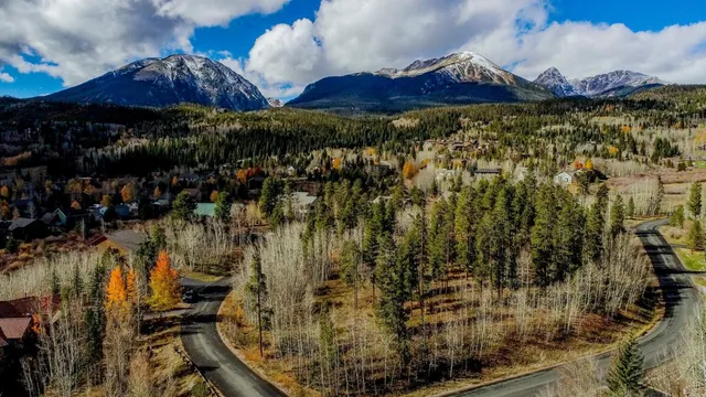 a view of a golf course with parking space