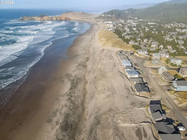 a kitchen with a sink a stove and cabinets