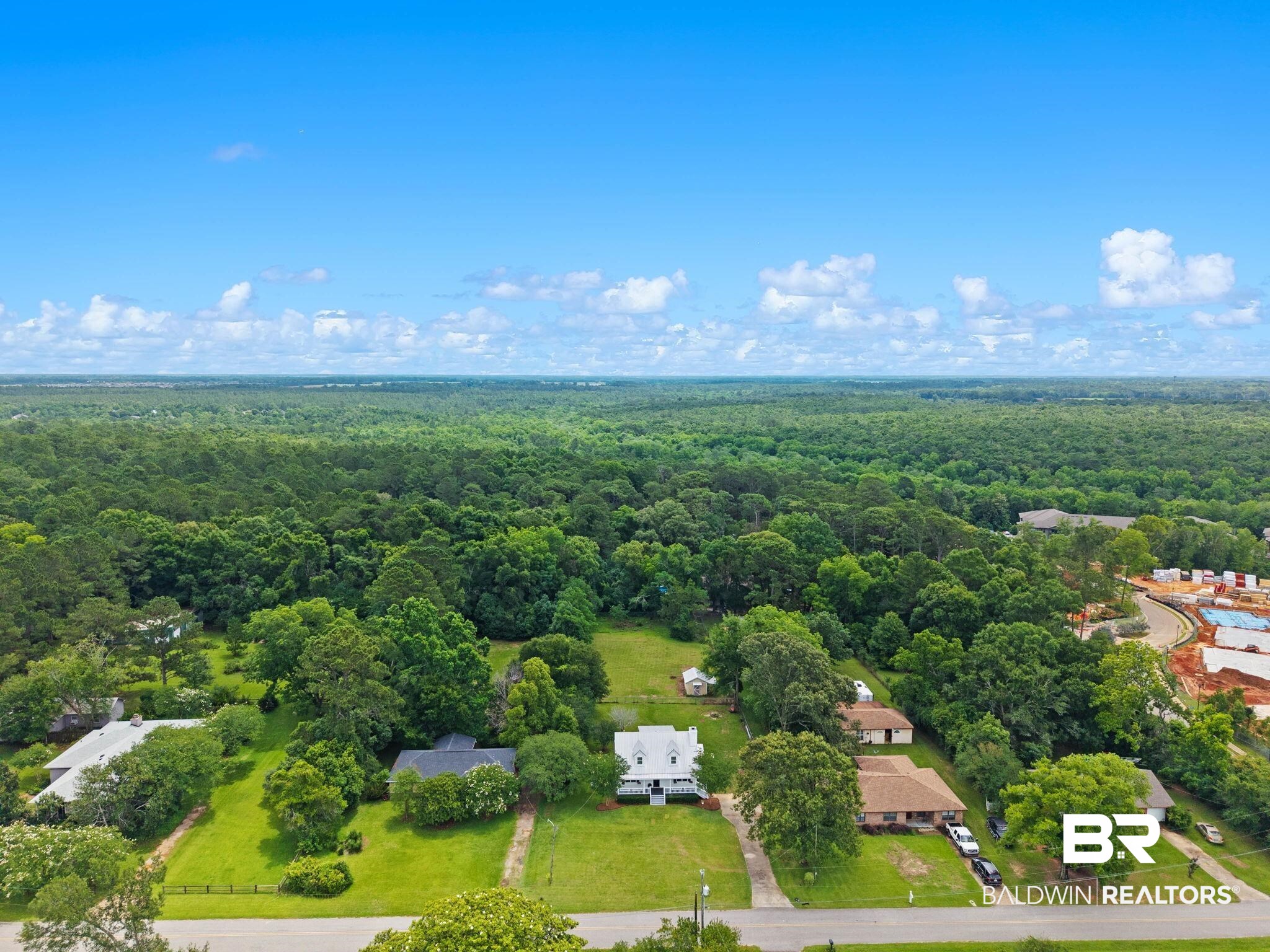 22810 High Ridge Road Fairhope, AL 36532 - Photo 74 of 78 Aerial perspective of a spacious property featuring a two-story residence with a white exterior