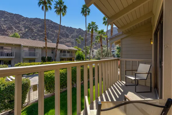 a view of swimming pool with a patio and a yard
