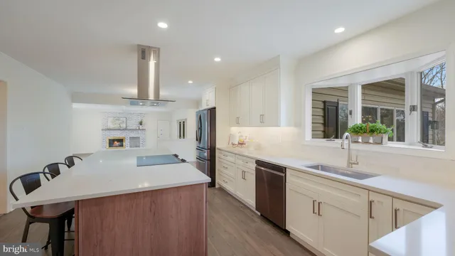 a kitchen with cabinets a sink and appliances