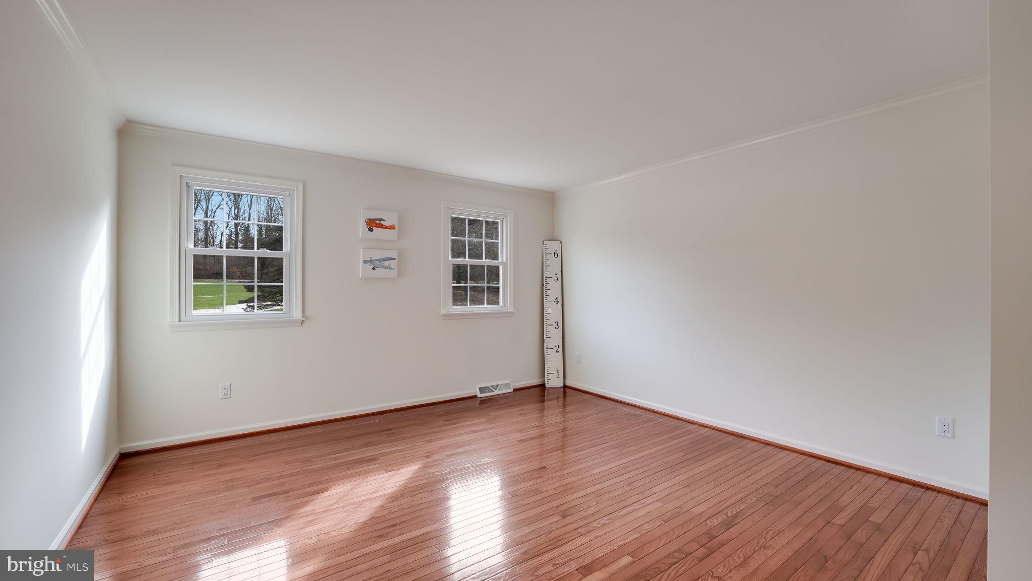 2520 Valley Road Jamison, PA 18929 - Photo 29 of 40 an empty room with wooden floor and windows