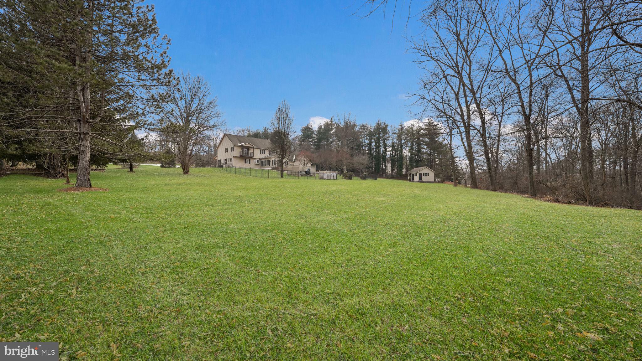 2520 Valley Road Jamison, PA 18929 - Photo 39 of 40 a grassy field with trees in the background