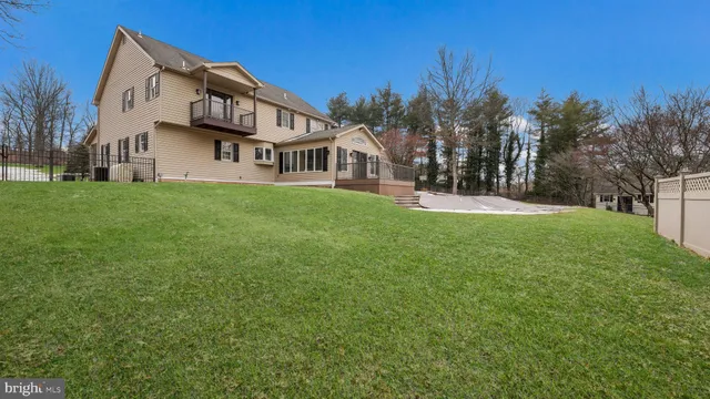a view of house with yard and green space