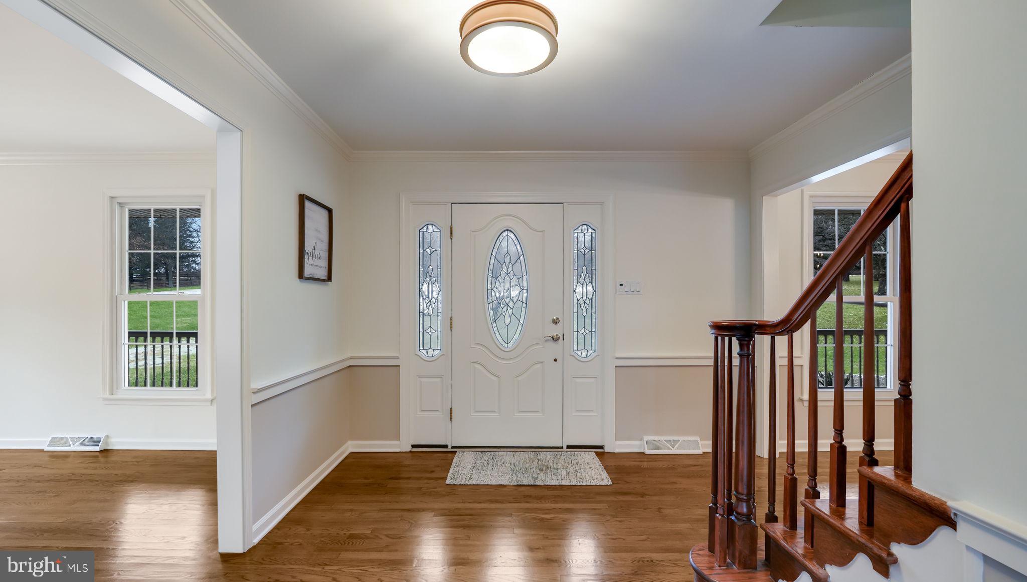 2520 Valley Road Jamison, PA 18929 - Photo 6 of 40 an entryway view with wooden floor and staircase