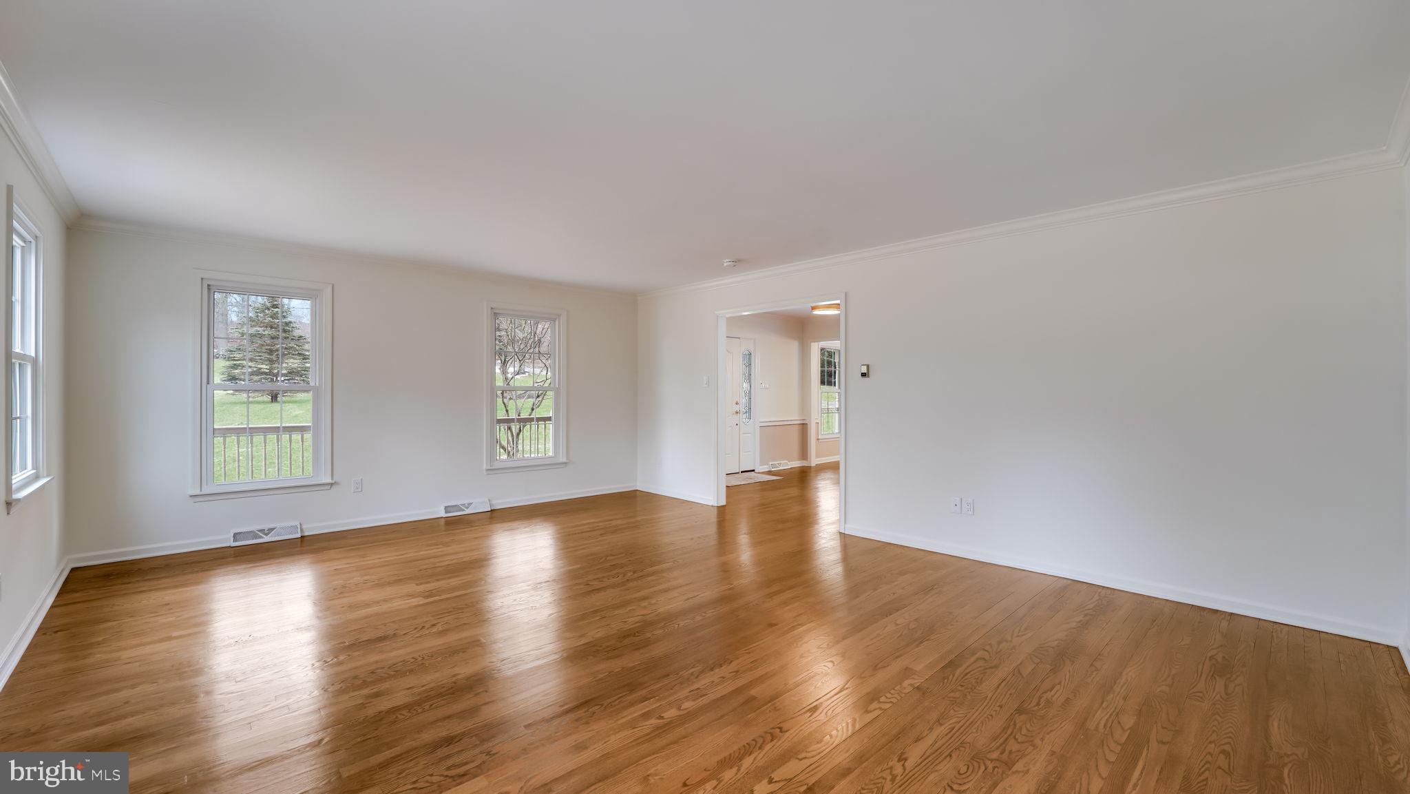 2520 Valley Road Jamison, PA 18929 - Photo 8 of 40 an empty room with wooden floor and windows