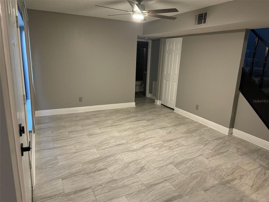 1030 Abada Court Northeast, Unit 110 Palm Bay, FL 32905 - Photo 5 of 10 a view of an empty room