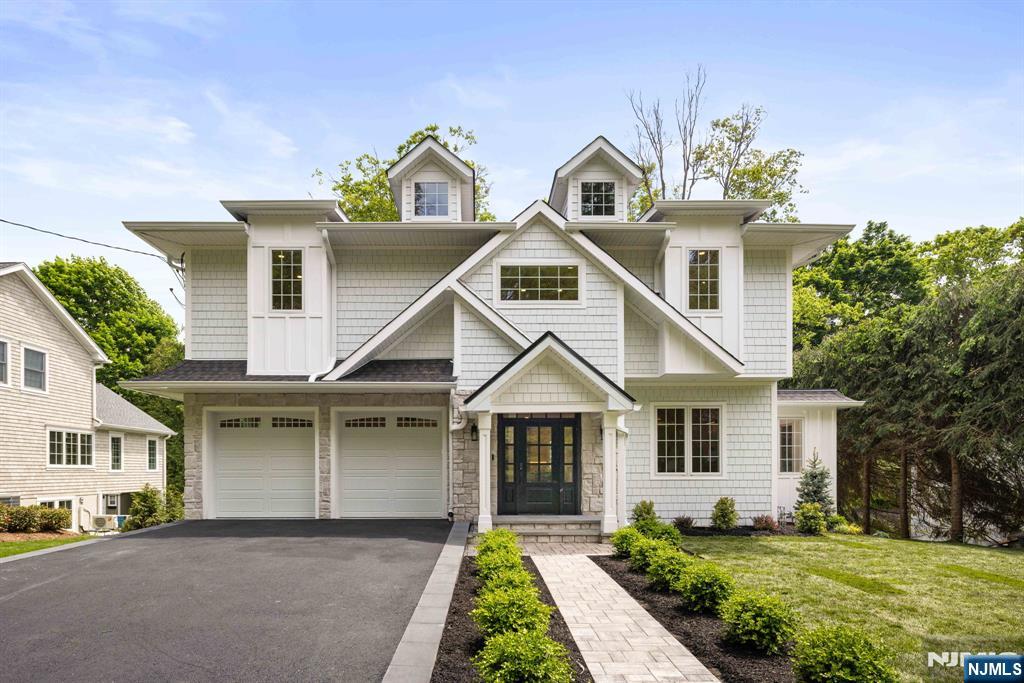 14 Beechwood Road Ho-Ho-Kus, NJ 07423 - Photo 1 of 31 a front view of a house with garden