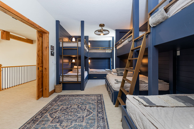 382 Ridgeview Street, Unit 8 & 9 Brian Head, UT 84719 - Photo 28 of 52 Custom-built bunk room featuring integrated storage, individual reading lights, and a central decorative ceiling fixture