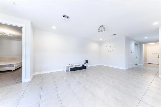 a large kitchen with cabinets and stainless steel appliances