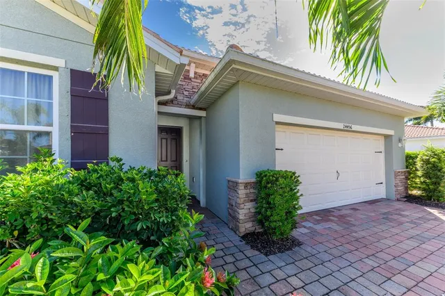 a front view of a house with garden