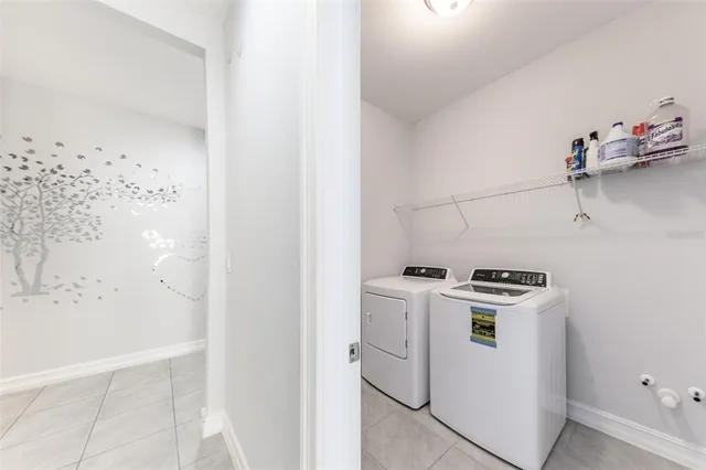 a utility room with dryer and washer