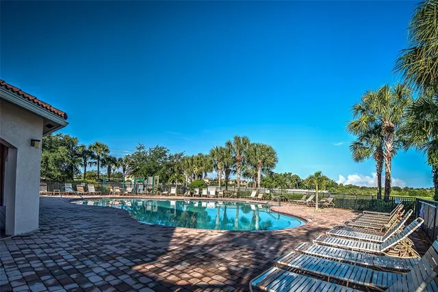 a view of a backyard with sitting area