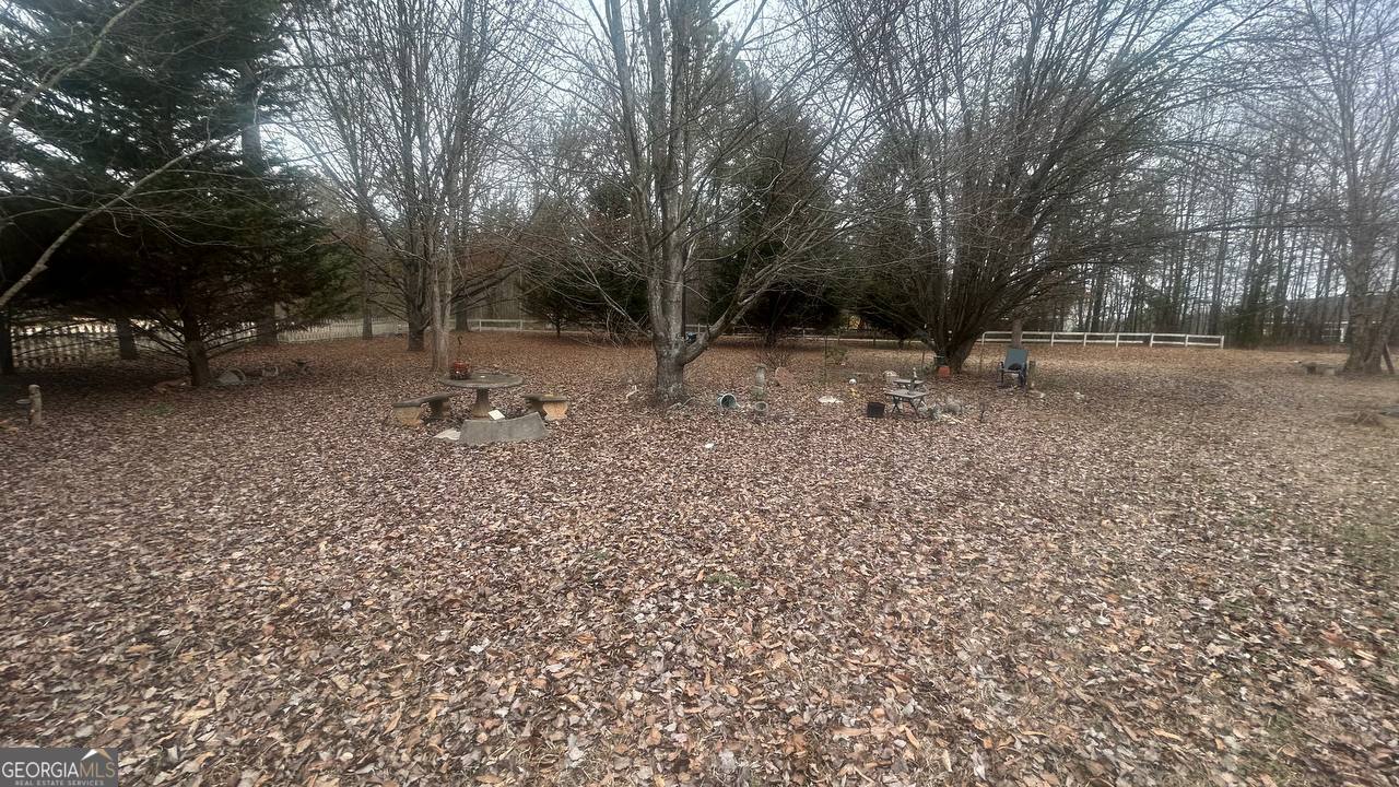 19 Kathryn Way Commerce, GA 30530 - Photo 8 of 14 a view of a tree in the middle of a yard