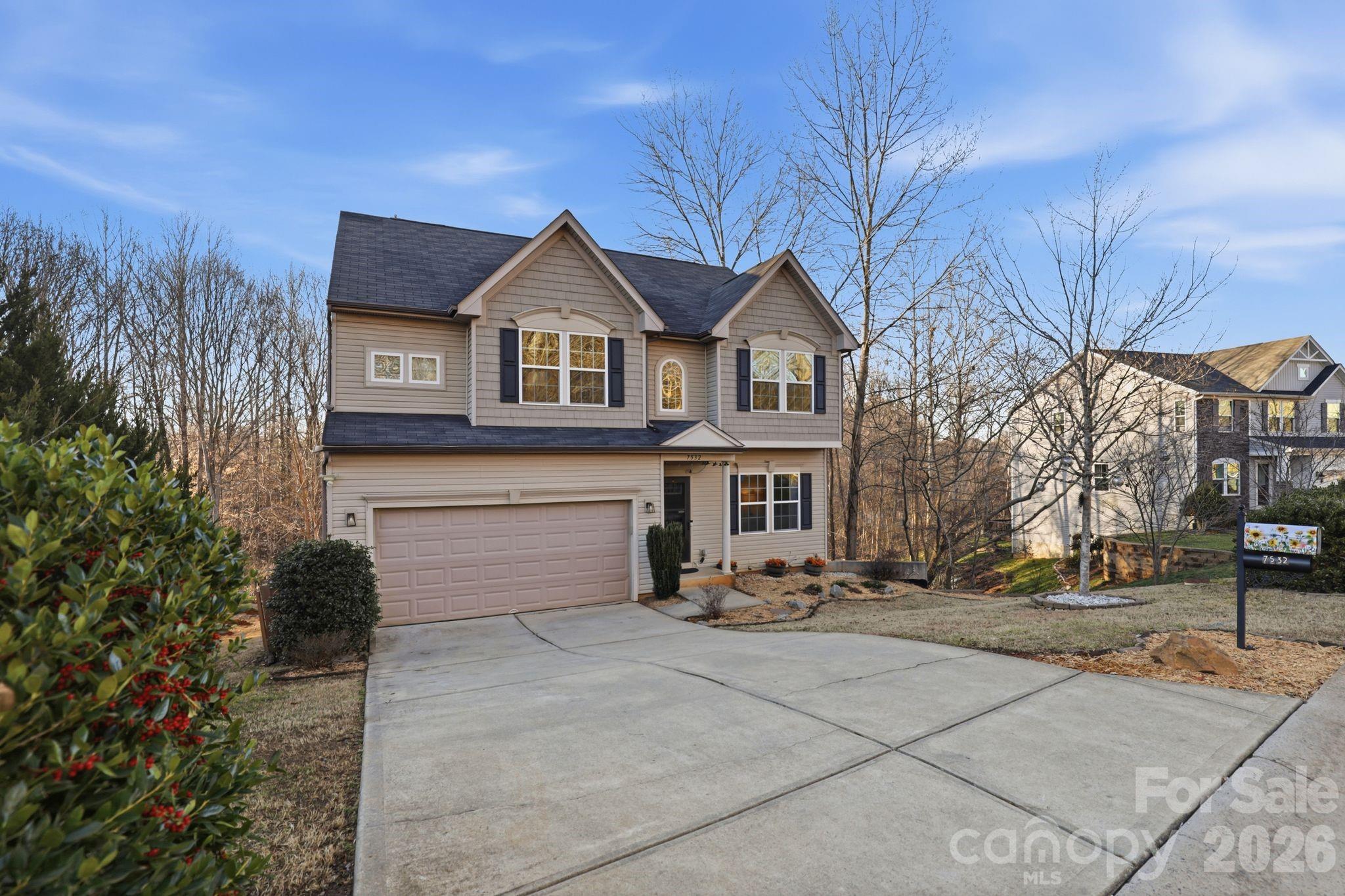 7532 West Berkeley Road, Unit 25 Denver, NC 28037 - Photo 2 of 36 a front view of a house with a yard