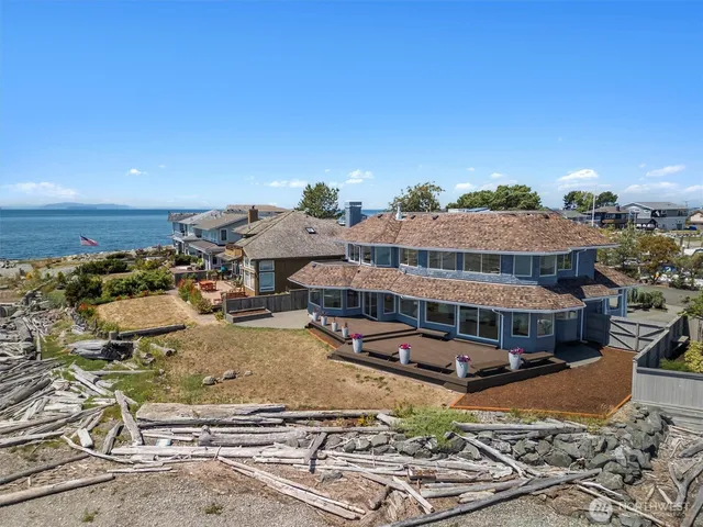 an aerial view of a house with a swimming pool