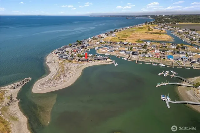an aerial view of a house with a lake view