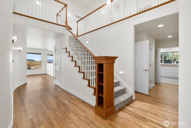 a view of a hallway view with staircase