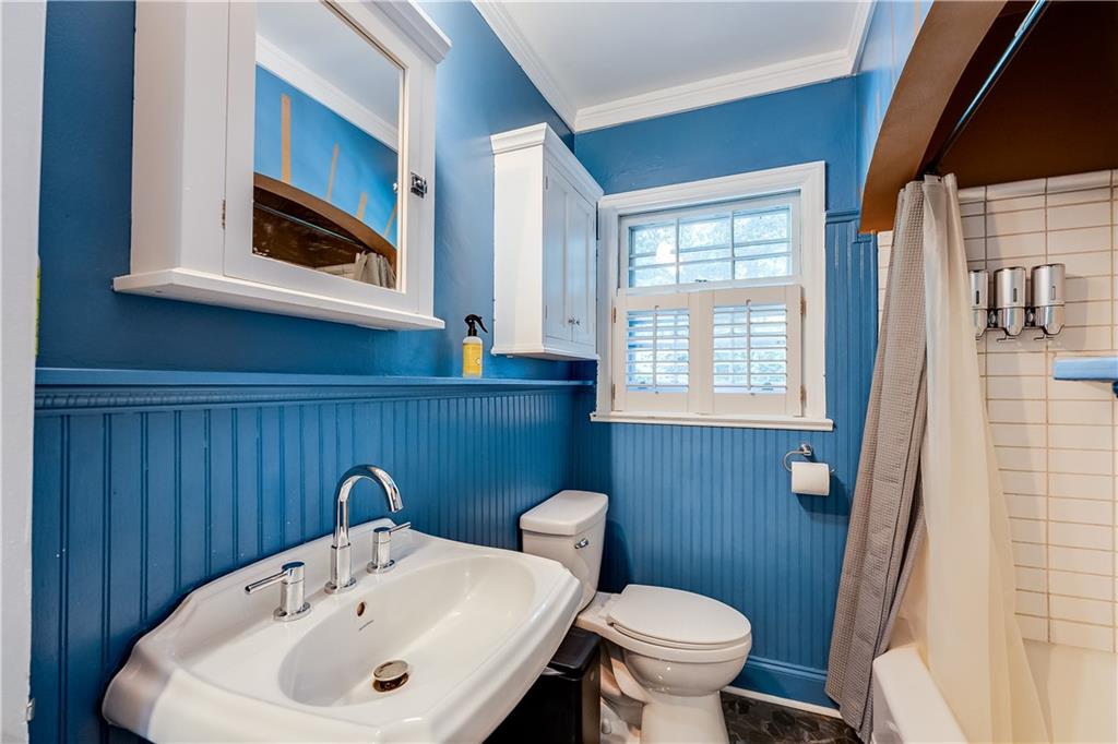 2083 West Rugby Avenue College Park, GA 30337 - Photo 19 of 49 a bathroom with a sink and a toilet