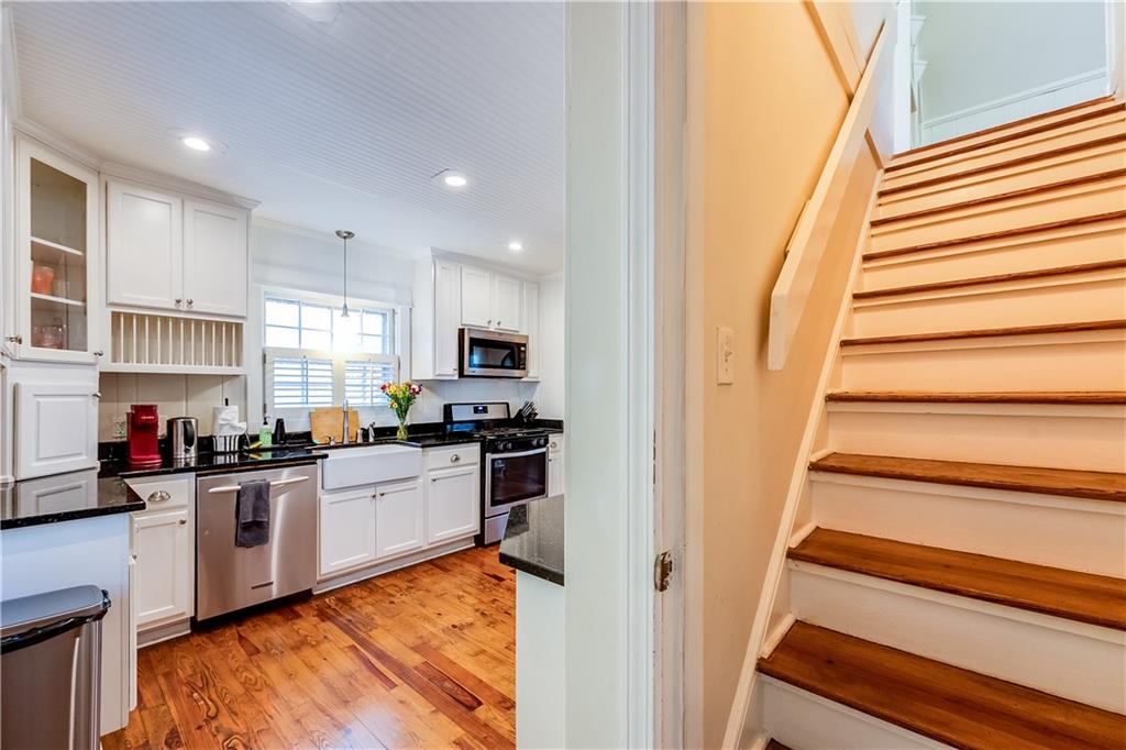 2083 West Rugby Avenue College Park, GA 30337 - Photo 27 of 49 a kitchen with stainless steel appliances granite countertop a refrigerator and a stove top oven