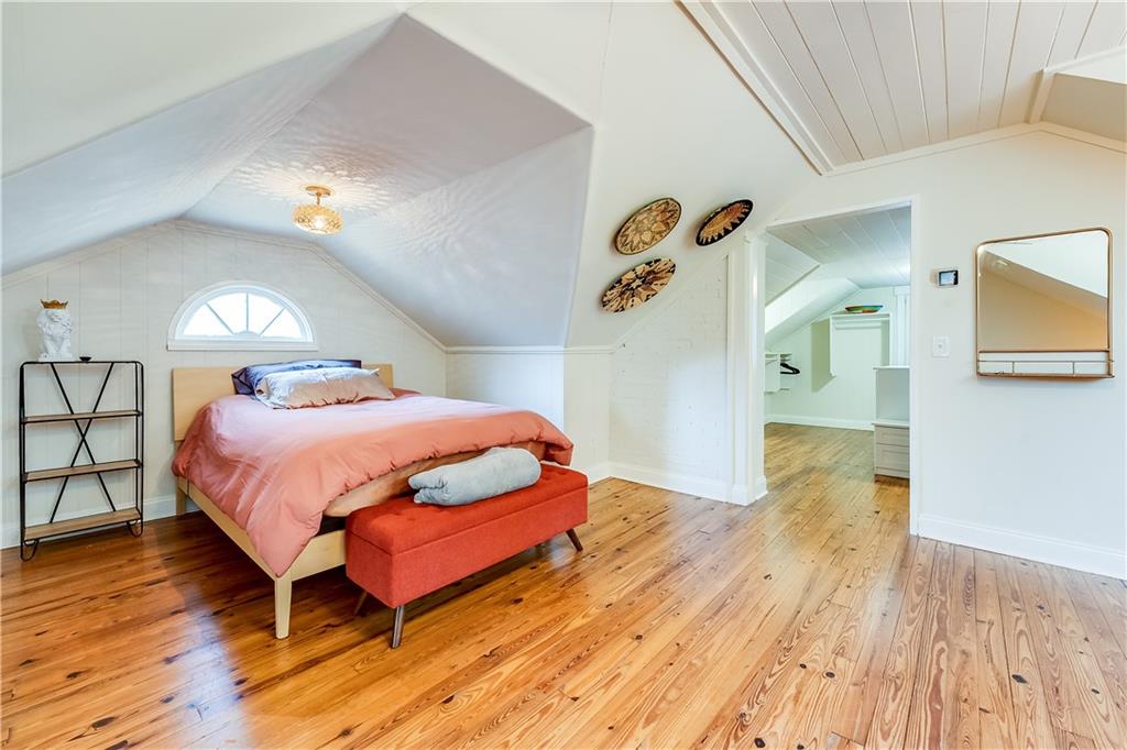 2083 West Rugby Avenue College Park, GA 30337 - Photo 29 of 49 a bedroom with a bed and wooden floor