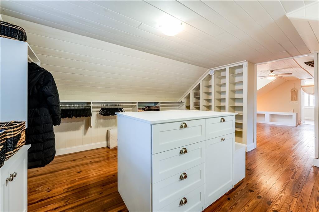 2083 West Rugby Avenue College Park, GA 30337 - Photo 33 of 49 a kitchen with a wooden floor and cabinets