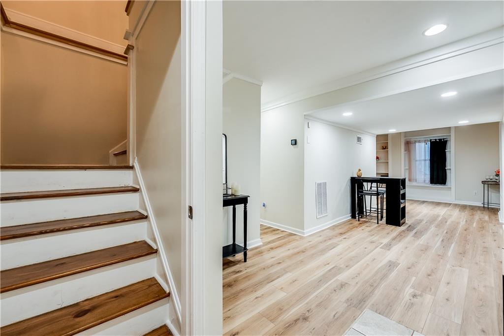 2083 West Rugby Avenue College Park, GA 30337 - Photo 37 of 49 a view of an empty room with wooden floor and a window
