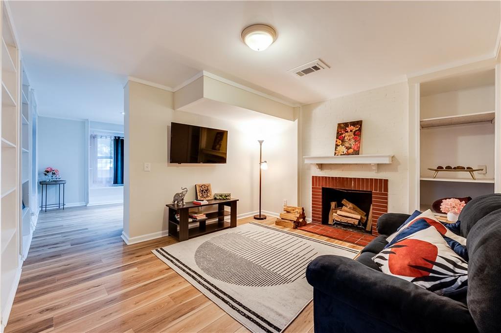 2083 West Rugby Avenue College Park, GA 30337 - Photo 39 of 49 a living room with furniture and a flat screen tv
