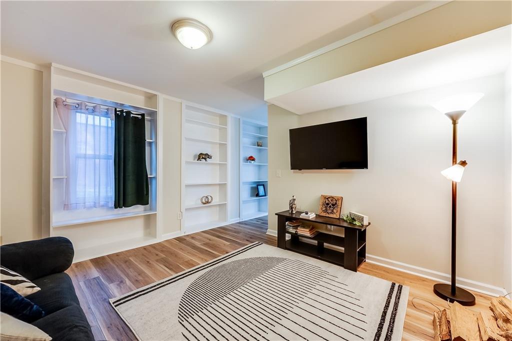 2083 West Rugby Avenue College Park, GA 30337 - Photo 40 of 49 a bedroom with a bed and a flat screen tv